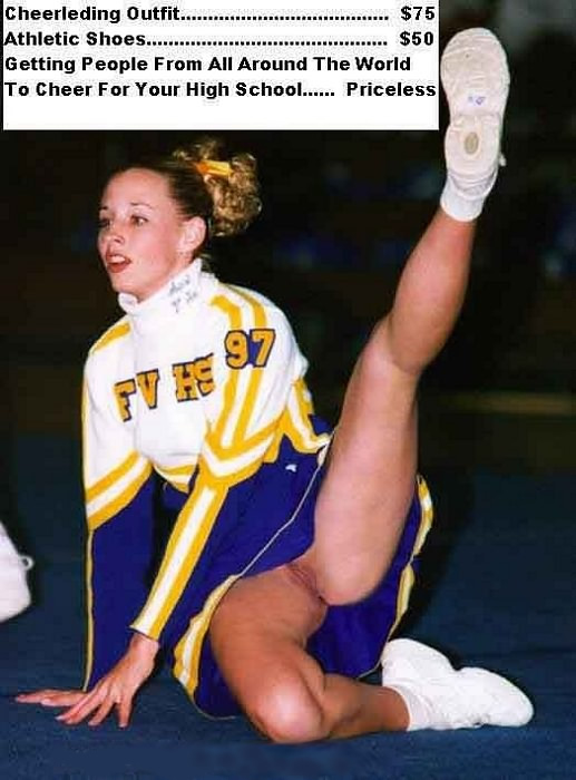 Cheerleader girl raising her leg with no panty below her dress