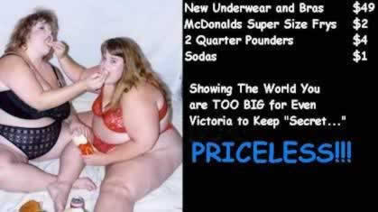 Two fat women sitting in the bed and feeding each other