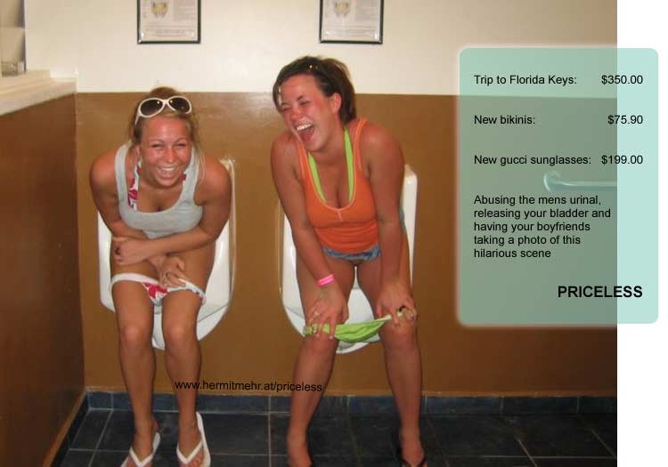 Two girls pissing in urinals